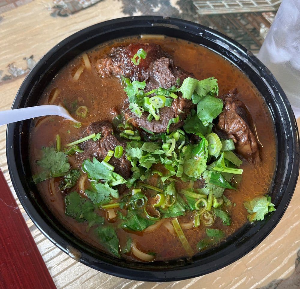 Beef Noodle Soup (牛肉汤面) — Rich and savory beef broth with tender beef slices and perfectly chewy noodles.