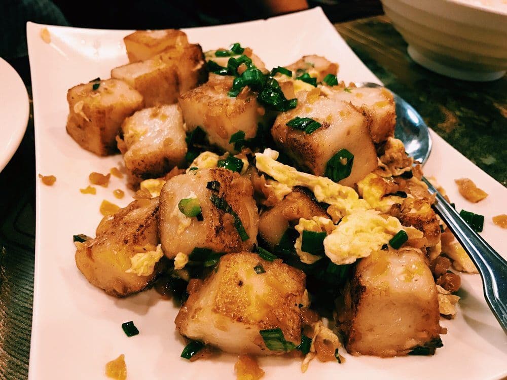 Radish Cake (萝卜糕) — Savory pan-fried turnip cakes with a crispy exterior and soft, flavorful center.