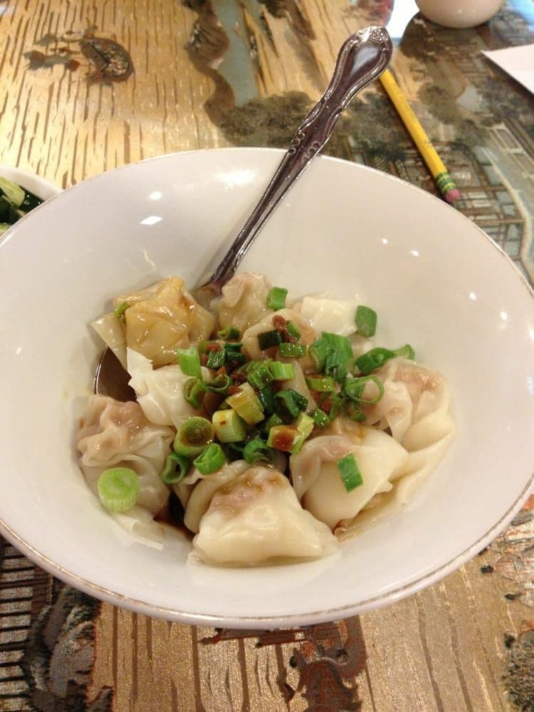 Spicy Wontons (红油抄手) — Silky wontons bathed in chili oil and savory sauce — bold, spicy, and addictive.