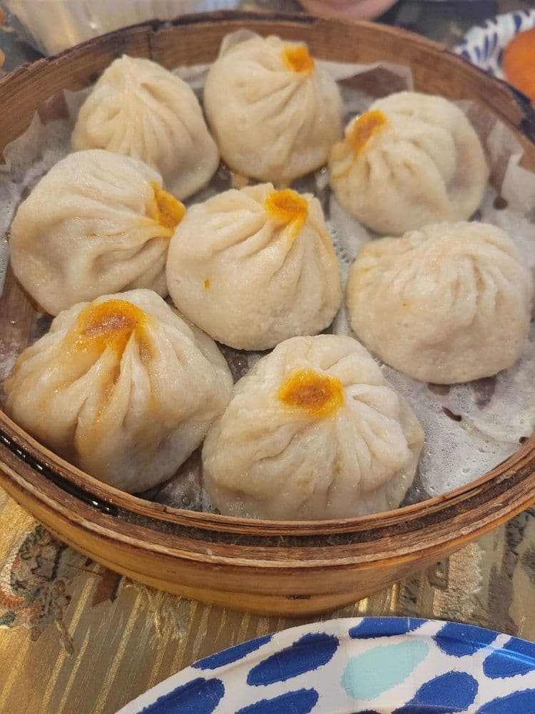 Xiao Long Bao (小笼包) — The authentic Shanghai classic with a thin, delicate skin and explosive hot broth.